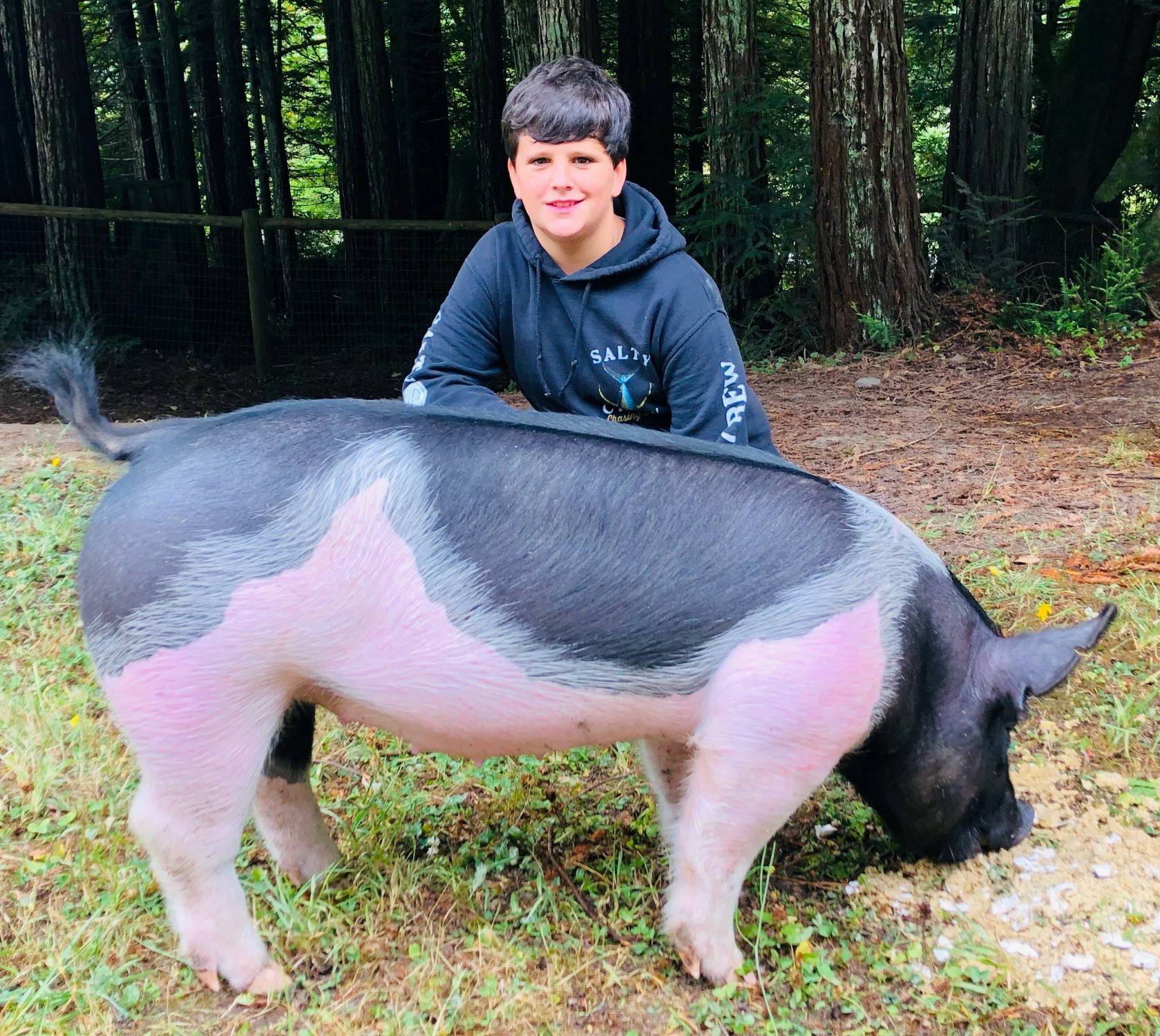 Brooks with his pig.